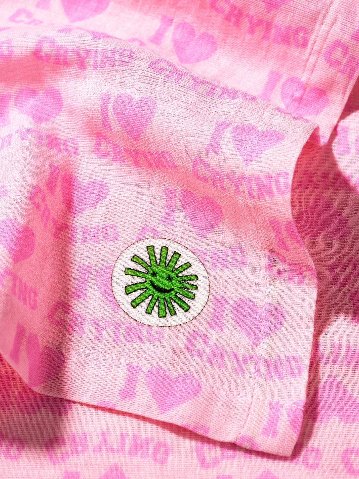 soft cotton baby muslin in stylish i heart crying print close up of the corner design sunny and moon logo