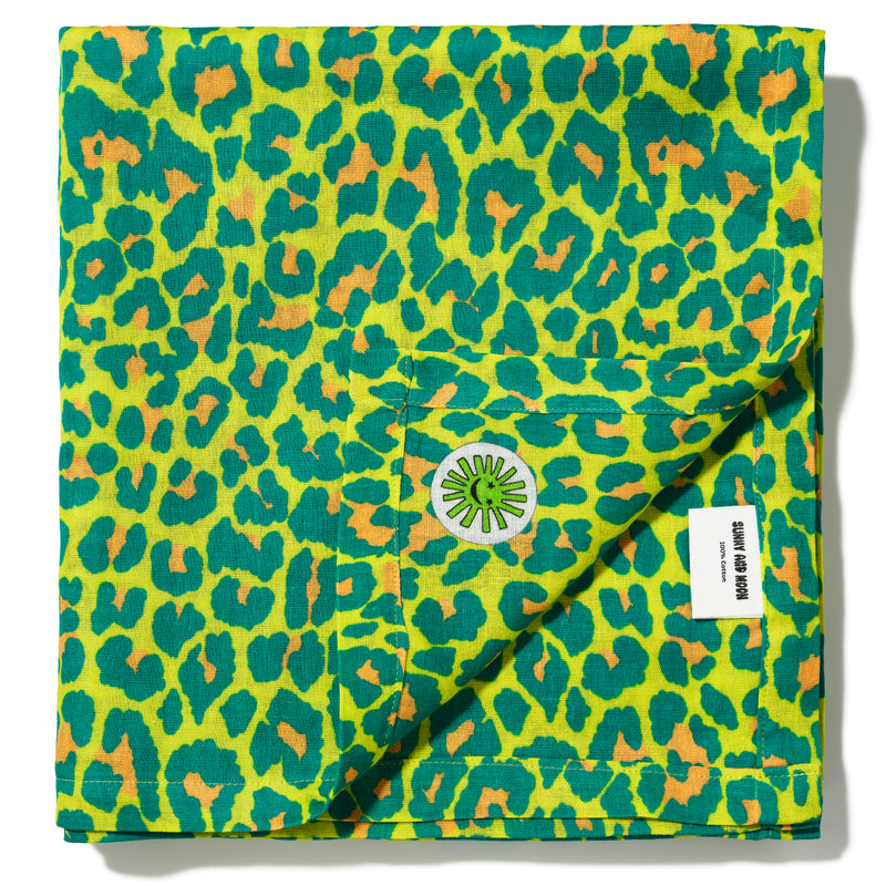 large green leopard print baby muslin cloth folded with corner detail - premium quality cotton by sunny and moon baby gift set luxury stylish cool
